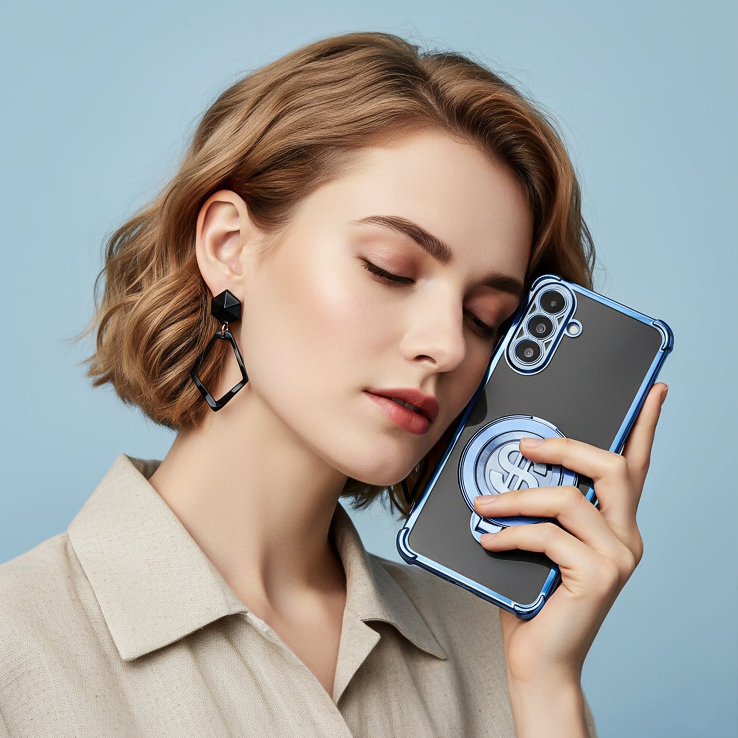 Woman holding a Samsung Galaxy A36 5G phone with a case against a light blue background