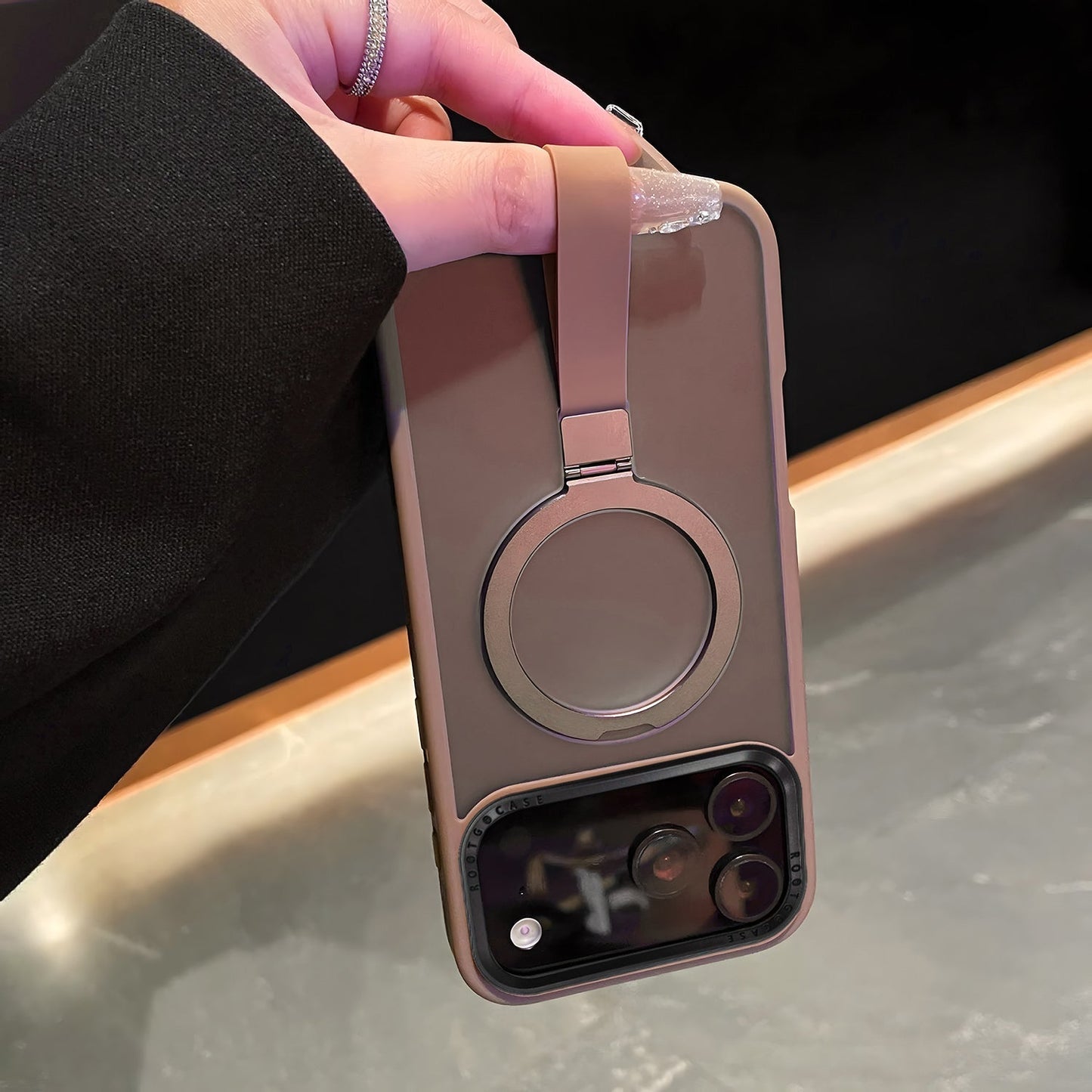 hand holding grip band case for iphone 17 Pro and Pro Max